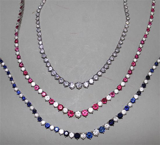 Three sterling silver and graduated paste set necklaces, including simulated ruby and diamond and simulated sapphire and diamond,